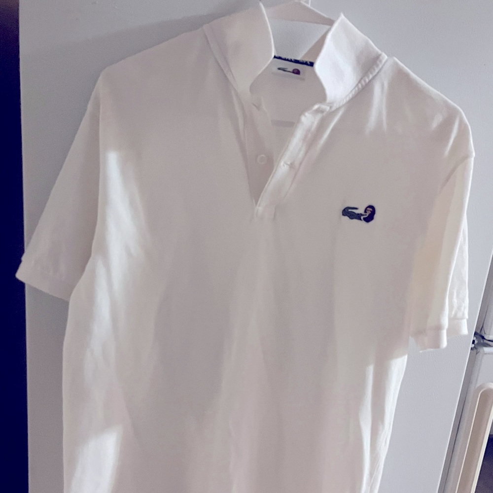Lacoste x bathing ape collaboration white polo. It’s says size 5 but that is UK